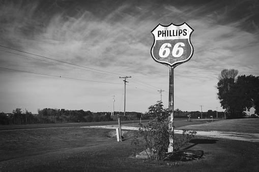 Manitowoc, Wisconsin, USA - July 21, 2022: An antique Phillips 66 gas station sign stands on the roadside in the county.