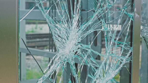 istock Public Property Shattered Glass Window Broken By Hooligans Vandalism or Bomb Blast 1420520396