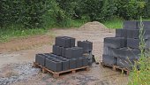 Stack of Ceiling Blocks Stored Outdoors at Residential Building Construction Site