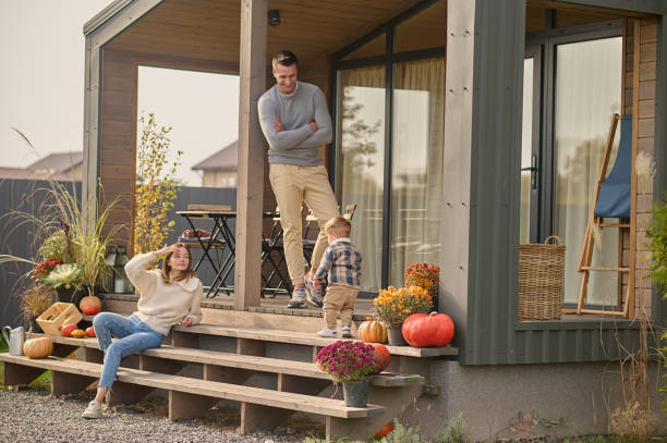 istock Young parents and their little kid on the veranda 1420520903