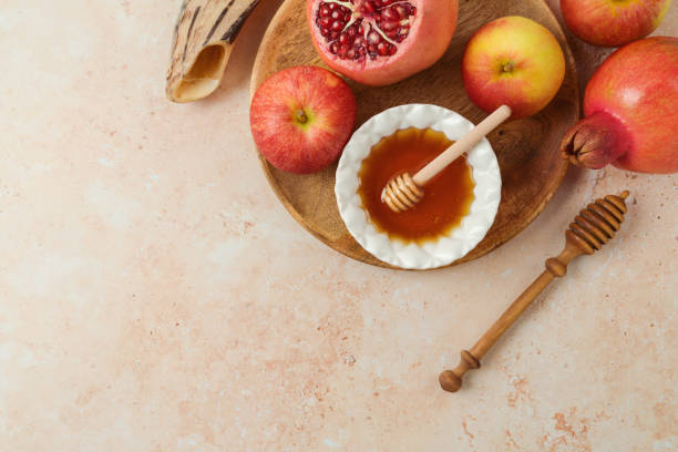 istock Rosh Hashanah top view background with honey, apple and pomegranate. Flat lay 1420522899