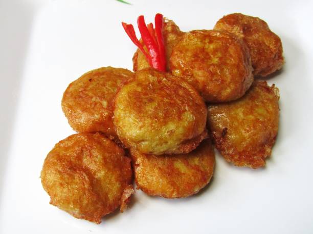 istock Perkedel on a white plate. Perkedel is an Indonesian food made from mashed potato and egg with seasoning 1420523682
