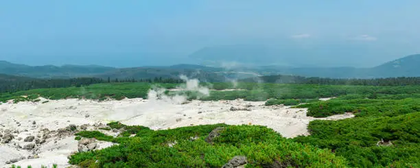 fumarole field on the slope of Mendeleev volcano on Kunashir island overlooking the ocean