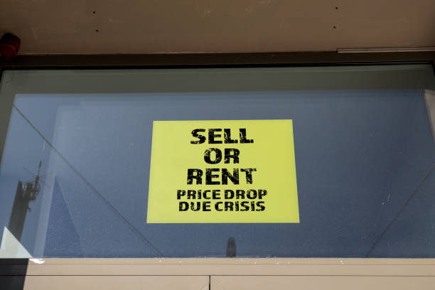 istock Sell or rent note on window. Price drop due crisis. Real estate concept 1420549063