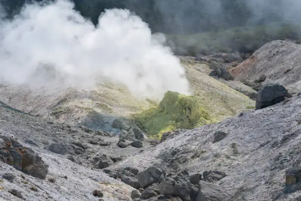 tower of crystallized sulfur around a solfatara in the fumarole field on the slope of a volcano