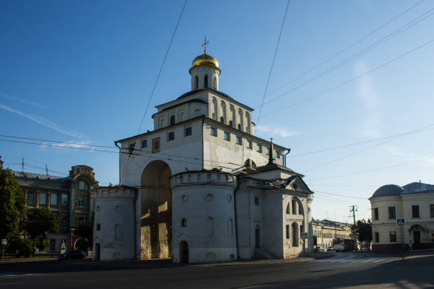 white stone Golden Gate the old white stone Golden Gate in the old town on a summer day against the blue sky in Vladimir golden gate vladimir stock pictures, royalty-free photos & images