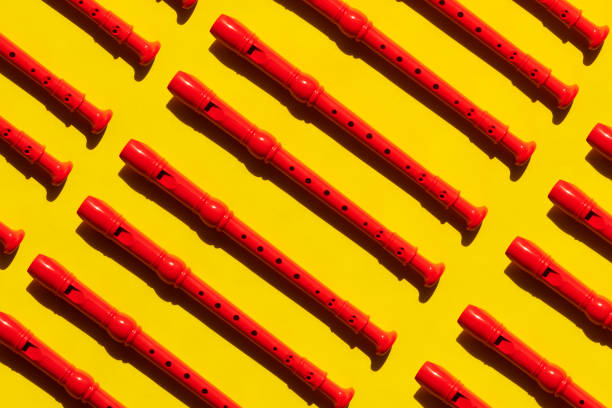 Flute in red color on yellow background