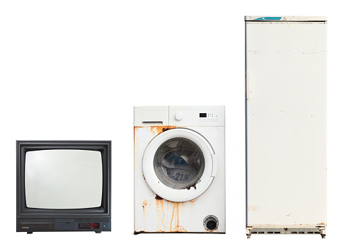 Old household appliances TV, washing machine, refrigerator isolated on white background.