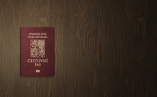 Czech passport on a wooden background, Czech passport is an international travel document issued to citizens of the Czech Republic