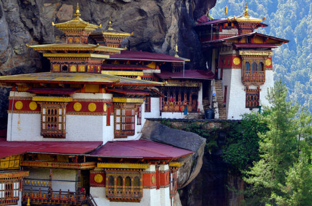 Tiger's Nest - Paro Taktsang monastery, built on a himalayan cliffside, whithout any vehicle access, Bhutan Bhutan: Tiger's Nest - Paro Taktsang / Taktsang Palphug monastery,  Bhutan's most iconic landmark and religious site - sacred Buddhist site located in the cliffside of the upper Paro valley - dedicated to Padmasambhava, aka Guru mTshan-brgyad Lhakhang or "Shrine of the Guru with Eight Names", refers to Padmasambhava's Eight Manifestations, built around a cave in 1692 by Gyalse Tenzin Rabgye -  Vajrayana / Tibetan Buddhism, Nyingma and Drukpa Kagyu sect. bhutanese culture photos stock pictures, royalty-free photos & images
