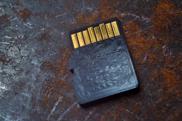 istock micro sd card lies on a dark background. close-up. 1420561616