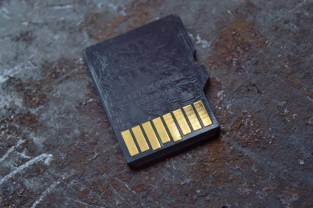 istock micro sd card lies on a dark background. close-up. 1420561656