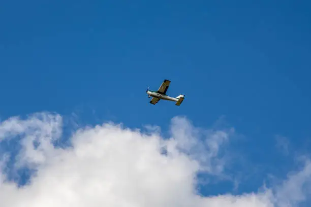 Photo of Small pleasure plane against the background of the blue sky. tourist aviation.