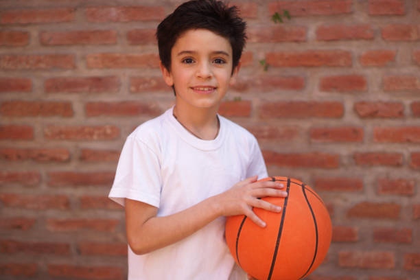 istock portrait of boy whit ball 1420563812