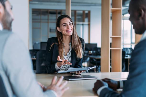 istock Group of business persons talking in the office. 1420571380