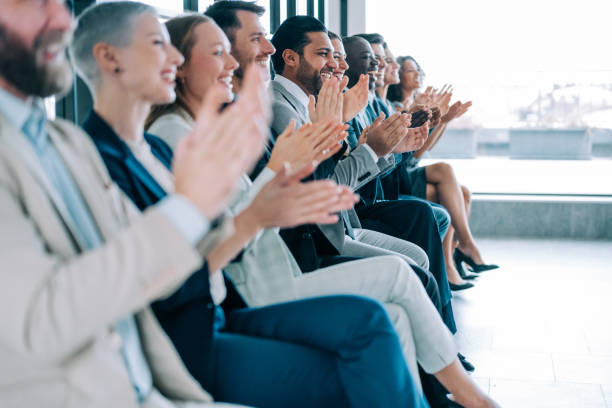 istock Businesspeople applauding during a seminar in conference hall. 1420571386