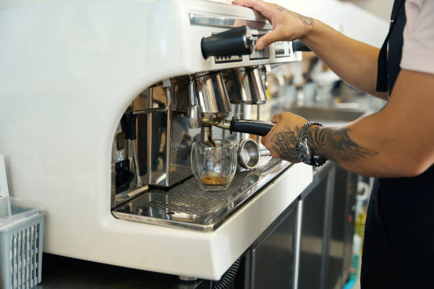 istock Skilled coffee shop worker preparing an espresso shot 1420573082