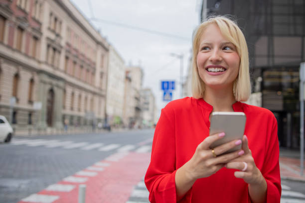 istock Happy woman using phone 1420577266