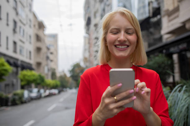 istock Happy woman using phone 1420577343