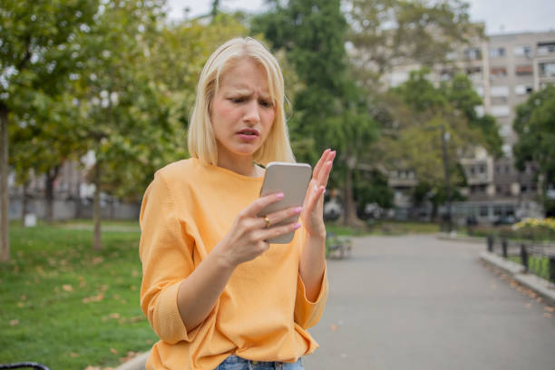 istock Happy young woman using phone 1420577517