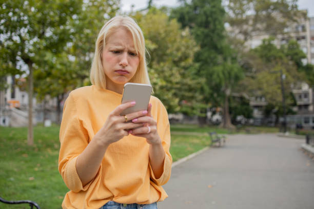 istock Happy young woman using phone 1420577522