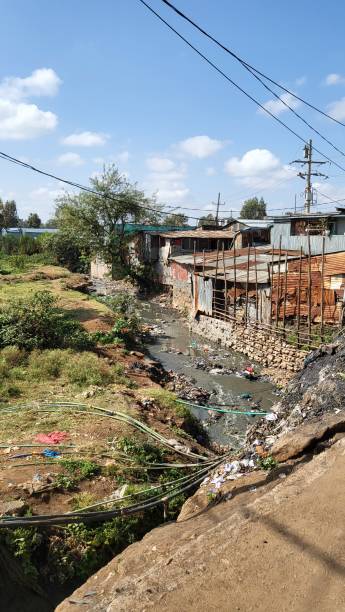 istock Garbage dump in a river that runs in Kibera slum, Nairobi, Kenya 1420582352