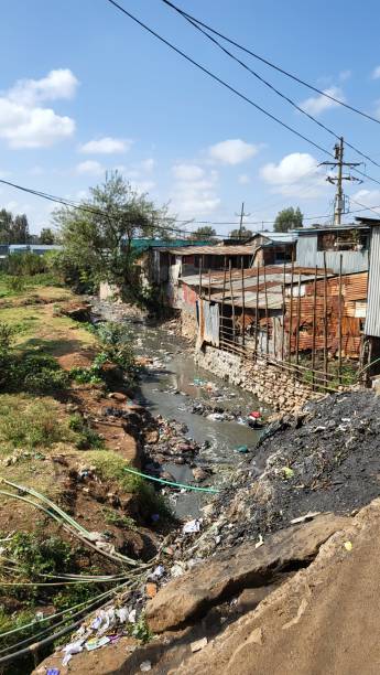 istock Garbage dump in a river that runs in Kibera slum, Nairobi, Kenya 1420582353