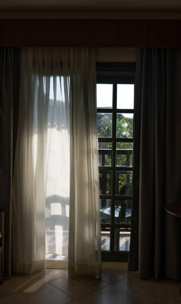 istock Balcony, reflection in the room of the setting sun 1420590108