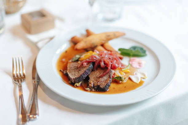 istock Delicious dinner beautifully arranged on a dinner plate. 1420590645