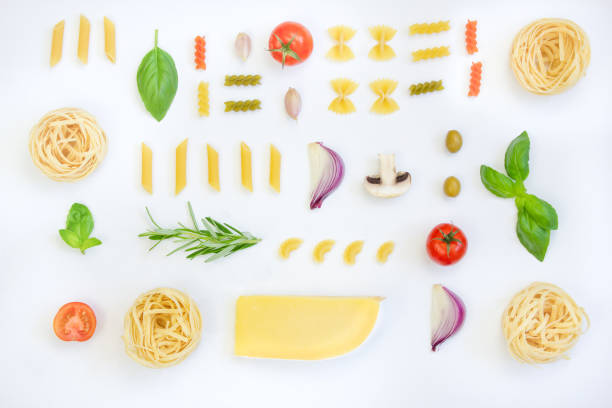 Ingredients for cooking pasta on a white background. Flat lay. Can be used for menu design.