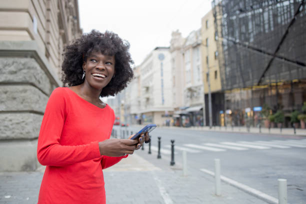 istock Happy woman using phone 1420595109