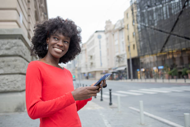 istock Happy young woman using phone 1420595117