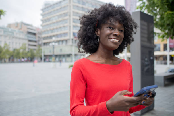 istock Happy woman using phone 1420595131