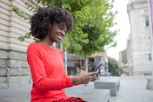 istock Happy woman using phone 1420595169