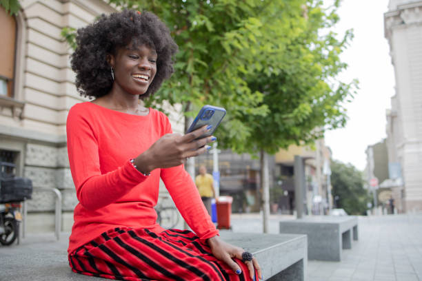 istock Happy young woman using phone 1420595179