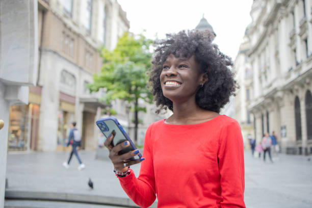 istock Happy woman using phone 1420595194