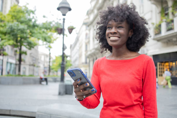 istock Happy woman using phone 1420595199