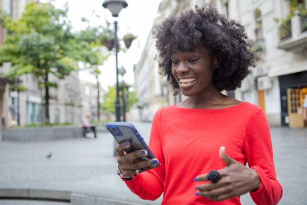 istock Happy young woman using phone 1420595201