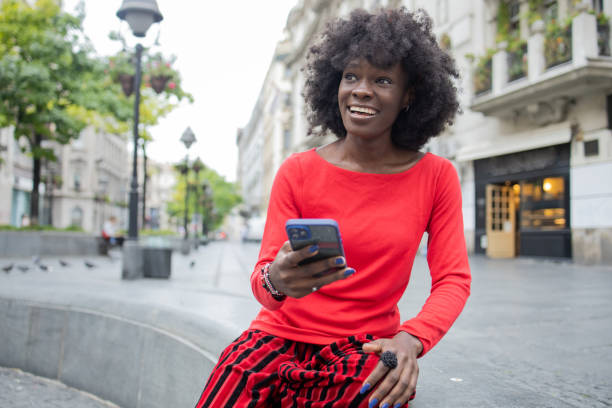istock Happy woman using phone 1420595219