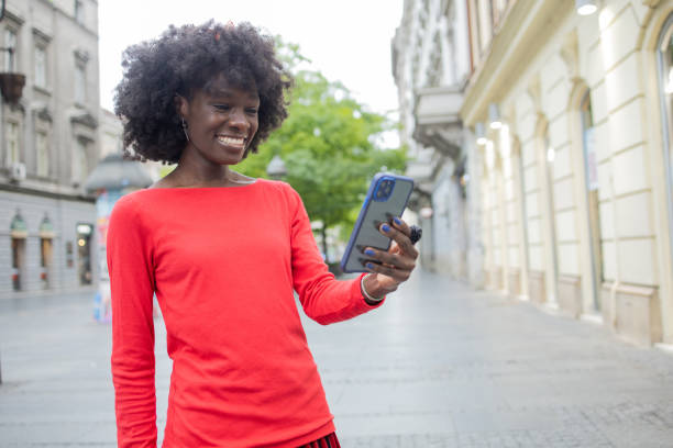 istock Happy woman using phone 1420595223