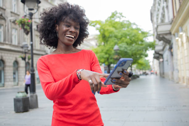 istock Happy woman using phone 1420595227