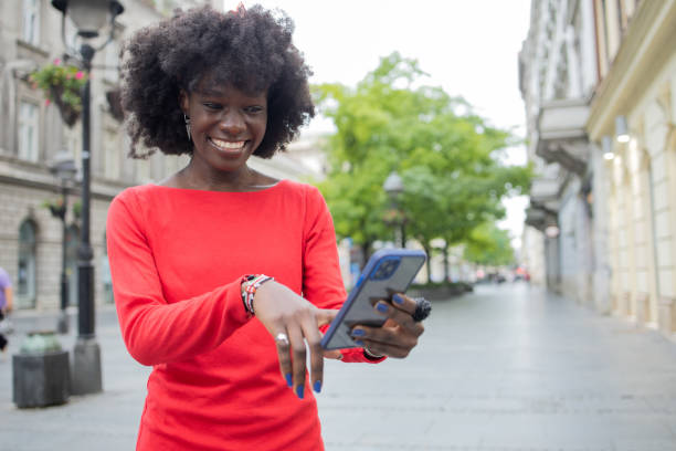 istock Happy young woman using phone 1420595229
