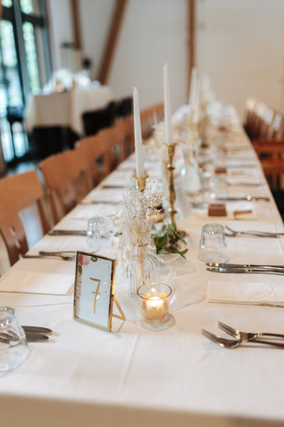 istock Elegant table setting and decoration for a dinner at a wedding location 1420595620