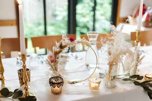 istock Elegant table setting and decoration for a dinner at a wedding location 1420596536