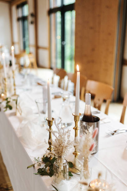 istock Elegant table setting and decoration for a dinner at a wedding location 1420596537