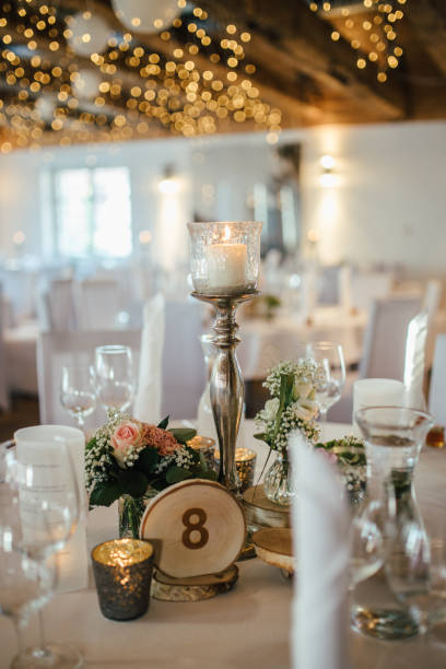 istock Elegant table setting and decoration for a dinner at a wedding location 1420598589