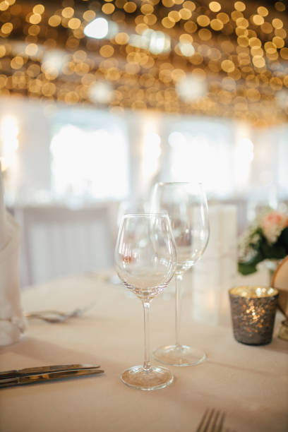 istock Elegant table setting and decoration for a dinner at a wedding location 1420599126