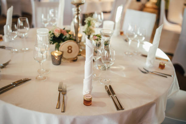 istock Elegant table setting and decoration for a dinner at a wedding location 1420599632