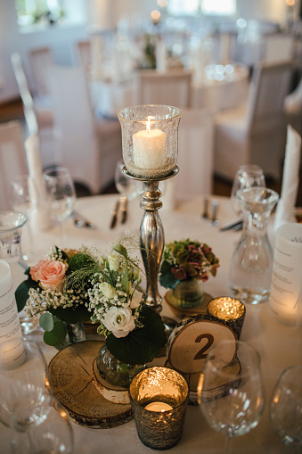 Elegant table setting and decoration for a dinner at a wedding reception