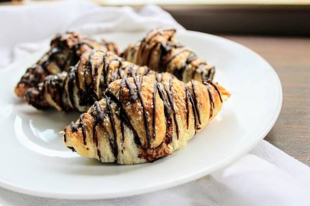 istock Mini Chocolate Drizzled Croissants 1420618816